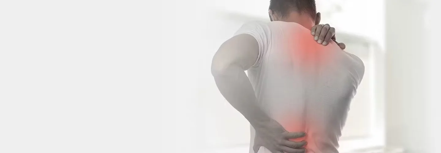 Person supporting their back and neck as part of an everyday wellness routine